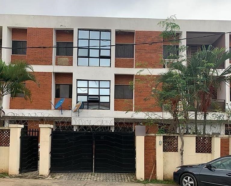 Three storey brick and white office building in Garki II, Abuja