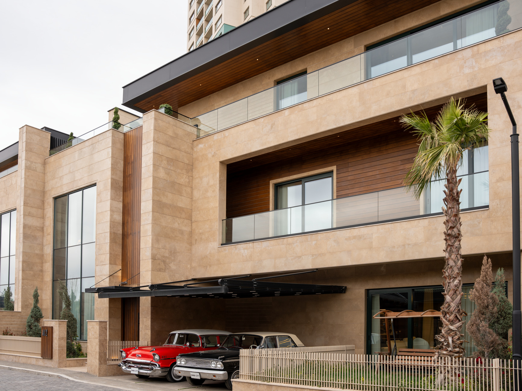 Stone and timber residence with a palm tree