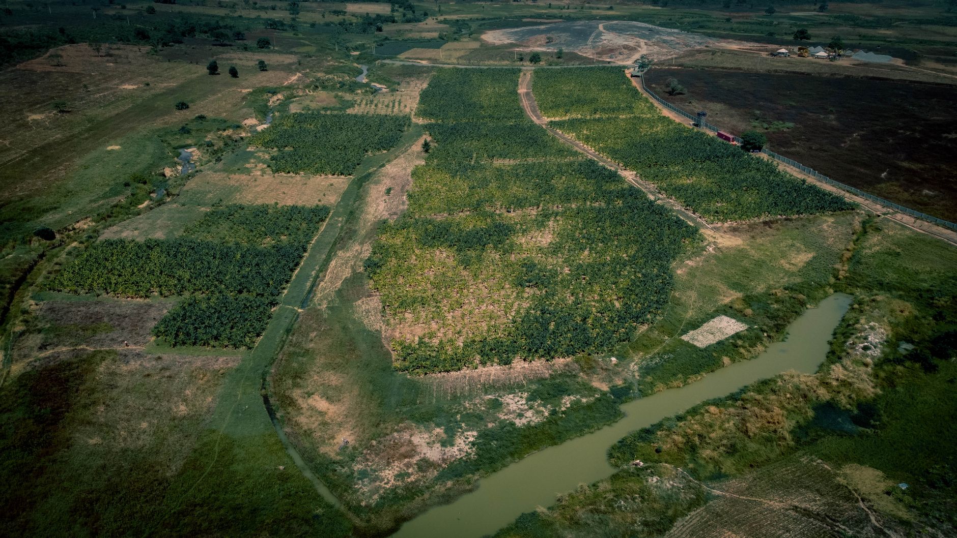 Aerial view of cleared land beside a river